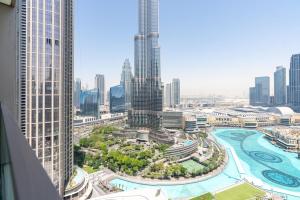 an aerial view of a city with tall buildings at Grande, Luxurious 2 BR, Burj Khalifa & Fountain view in Dubai