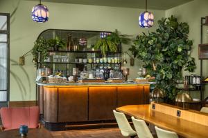 a restaurant with a bar with tables and chairs at The July - Twenty Eight in Amsterdam