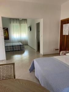 Postel nebo postele na pokoji v ubytování Casa Rosetta Affittacamere