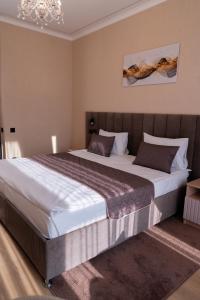 Postel nebo postele na pokoji v ubytování Hotel Palace Ukraine