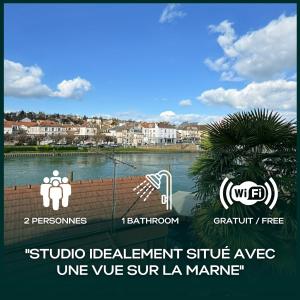 a sign for a resort with a view of a body of water at Le Cosy Lagny - Appartement Cosy avec balcon vue sur Marne in Lagny