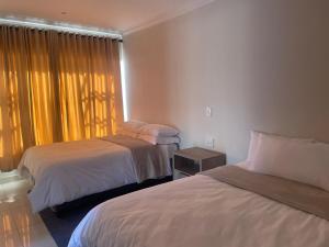 Una cama o camas en una habitación de Peace Haven