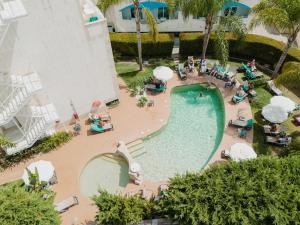 an overhead view of a swimming pool at a resort at Velamar Boutique Hotel - Adults Friendly in Albufeira