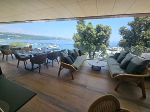 a room with a table and chairs and a large window at Amadria Park Grand Hotel 4 Opatijska Cvijeta in Opatija