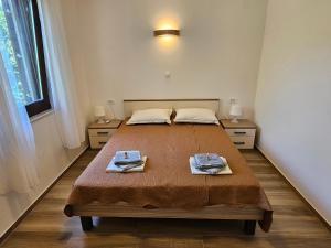 a bedroom with a bed with two towels on it at Villa Kučan in Porat