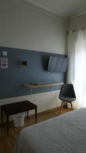 Ένα ή περισσότερα κρεβάτια σε δωμάτιο στο Residencial Moderna