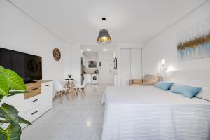 Ένα ή περισσότερα κρεβάτια σε δωμάτιο στο Beautiful Studio Del Cura Beach