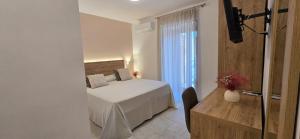 Postel nebo postele na pokoji v ubytování Hotel Punta San Francesco