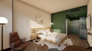 a bedroom with a bed and a chair at Novotel Zagreb in Zagreb