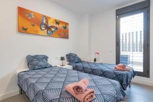 Posteľ alebo postele v izbe v ubytovaní Beachfront Apartment 034