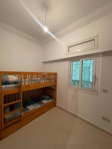 Katil atau katil-katil dalam bilik di Al kawtar Vacation apartment in Mansouria