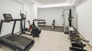 a gym with cardio equipment in a room at Sercotel Cruz Del Mar in Chipiona