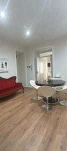 a living room with a table and a couch at Esperia Maison B&b in Montesarchio