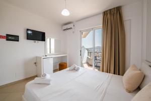 Postel nebo postele na pokoji v ubytování Sunshine Hotel