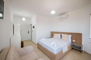 Postel nebo postele na pokoji v ubytování Sunshine Hotel
