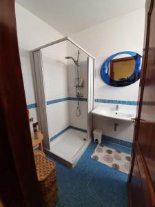 a bathroom with a shower and a sink at Casa Salento in Alezio