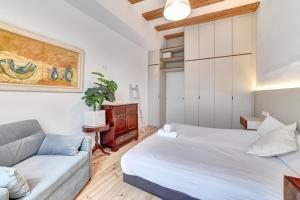 a living room with two beds and a couch at Castillo 31 by Clabao in Pamplona