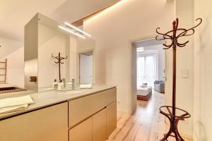 a bathroom with a sink and a mirror at Castillo 31 by Clabao in Pamplona +21 photos