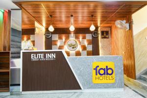 En logo, et sertifikat eller et firmaskilt på FabHotel Elite Inn- Nr JNTU Metro Station JNTU College