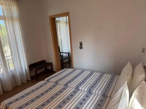 Pythaïs Hotel客房内的一张或多张床位