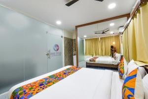 En eller flere senger på et rom på FabHotel Elite Inn- Nr JNTU Metro Station JNTU College
