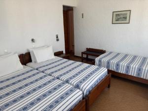 Pythaïs Hotel客房内的一张或多张床位