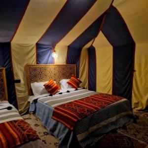 Postel nebo postele na pokoji v ubytování Luxurious Trips Camp