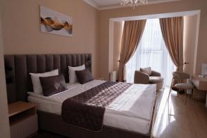 Postel nebo postele na pokoji v ubytování Hotel Palace Ukraine