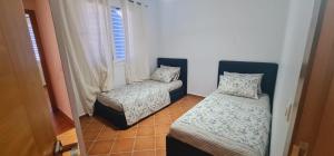 Postel nebo postele na pokoji v ubytování Martil wow