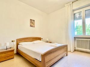 Postel nebo postele na pokoji v ubytování Spazioso e vicino al mare - Casa MareBlu