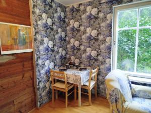 a dining room with a table and chairs at Matrix Garden Apartments in Tallinn