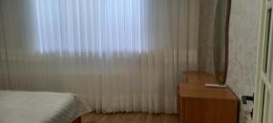 Giường trong phòng chung tại Qusar Apartment