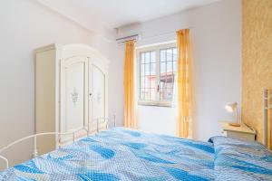 A bed or beds in a room at Villa delle Rose