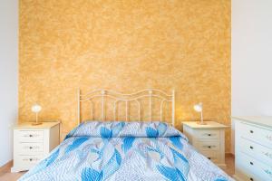 A bed or beds in a room at Villa delle Rose