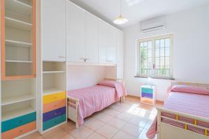 A bed or beds in a room at Villa delle Rose