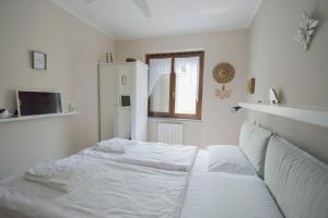 Posteľ alebo postele v izbe v ubytovaní Alessandra 2 Apartment by Wonderful Italy + 7 fotografií