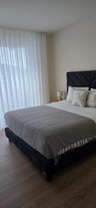 Ένα ή περισσότερα κρεβάτια σε δωμάτιο στο Soldouro Aveiro Station