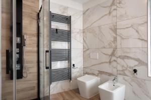a bathroom with a toilet and a sink at Casa della Rosina in Bresimo +35 photos