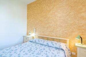 A bed or beds in a room at Villa delle Rose