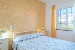 A bed or beds in a room at Villa delle Rose