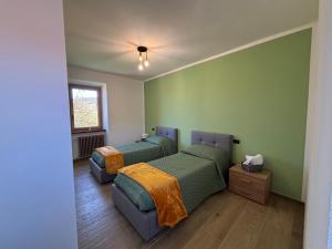 Postel nebo postele na pokoji v ubytování Cascina Barbei