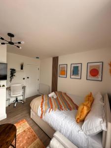 a bedroom with a bed and a desk in it at R4 - Luxury fully Self-Contained Studio with Private Bathroom and Kitchen in Halesowen