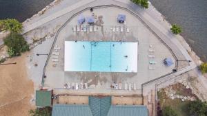 an overhead view of a swimming pool on a beach at Baldknobber Ridge Escape - West Branson Cabin in Branson West