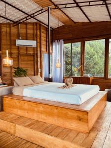 Postel nebo postele na pokoji v ubytování Jungle Breeze