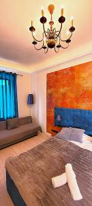 Katil atau katil-katil dalam bilik di Chmielna 5 Rooms & Apartments