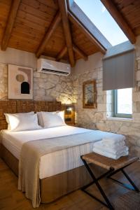 Ένα ή περισσότερα κρεβάτια σε δωμάτιο στο Plasis country suites 2
