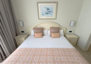 Cama ou camas em um quarto em Holiday Club Playa Amadores