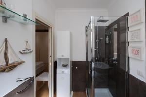 a bathroom with a shower and a sink at Brezza Marina in Lido di Ostia +42 photos