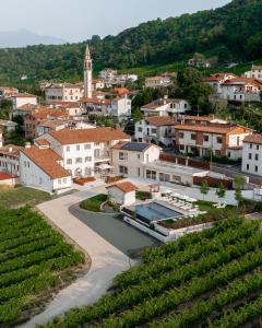 a view of a town with a vineyard at Agriturismo Prà dell'Ort - Wishing Wellness in Valdobbiadene +52 photos