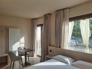 Ένα ή περισσότερα κρεβάτια σε δωμάτιο στο Locanda Al-Colle